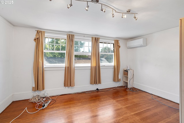 7315 N Smith St, Portland, OR 97203 - unfurnished room featuring a wall unit AC, wood finished floors, and ornamental molding