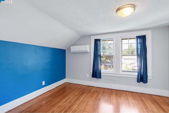 7315 N Smith St, Portland, OR 97203 - bonus room with a wall mounted air conditioner, lofted ceiling, and hardwood / wood-style floors
