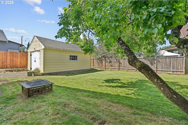 7315 N Smith St, Portland, OR 97203 - fenced backyard with a storage shed and an outdoor fire pit