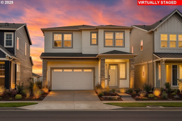 17890 SW Alvord Ln, Beaverton, OR 97007 - view of front facade featuring driveway, a garage, stucco siding, stone siding, and roof with shingles
