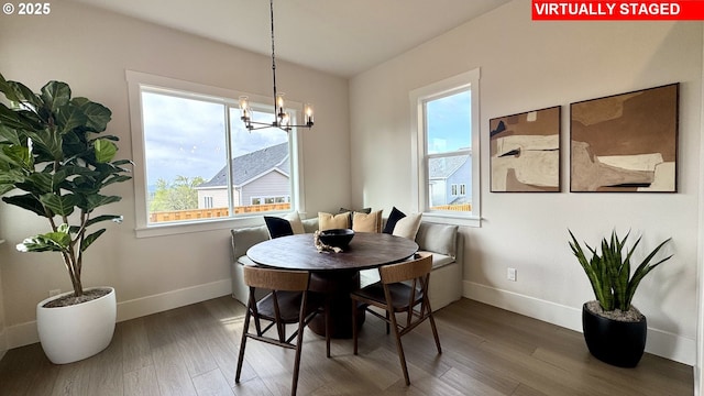 17890 SW Alvord Ln, Beaverton, OR 97007 - dining area with healthy amount of natural light, wood finished floors, and a chandelier