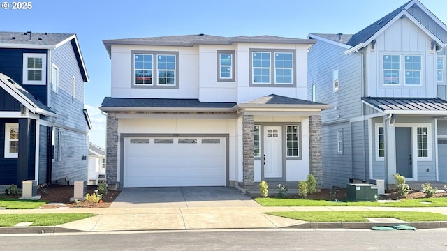 17890 SW Alvord Ln, Beaverton, OR 97007 - view of front of home featuring stone siding, driveway, a garage, and board and batten siding