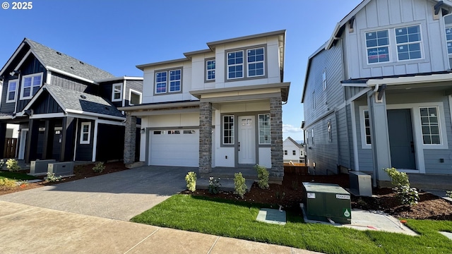 17890 SW Alvord Ln, Beaverton, OR 97007 - view of front facade featuring concrete driveway, a garage, board and batten siding, and stone siding