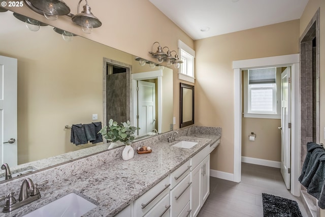 2343 N Fork Rd, Seaside, OR 97138 - bathroom featuring double vanity and baseboards