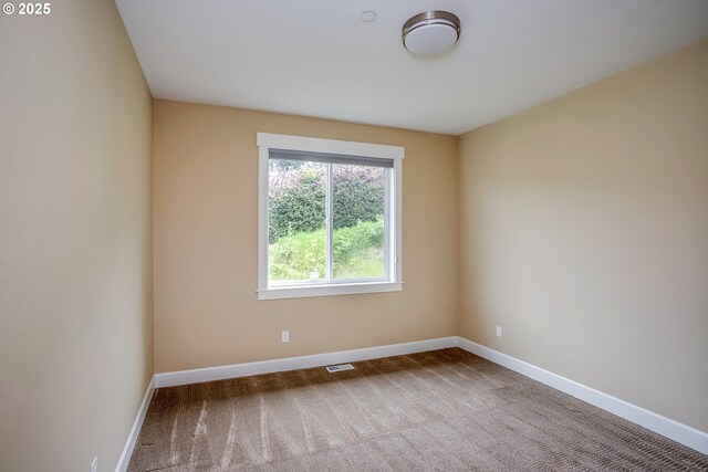 2343 N Fork Rd, Seaside, OR 97138 - carpeted empty room featuring baseboards