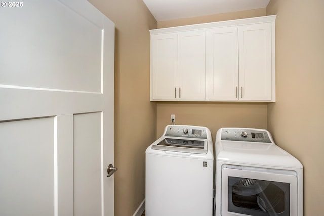 2343 N Fork Rd, Seaside, OR 97138 - washroom with washer and clothes dryer and cabinet space