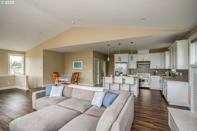 2343 N Fork Rd, Seaside, OR 97138 - living room with lofted ceiling, dark wood-style flooring, and baseboards