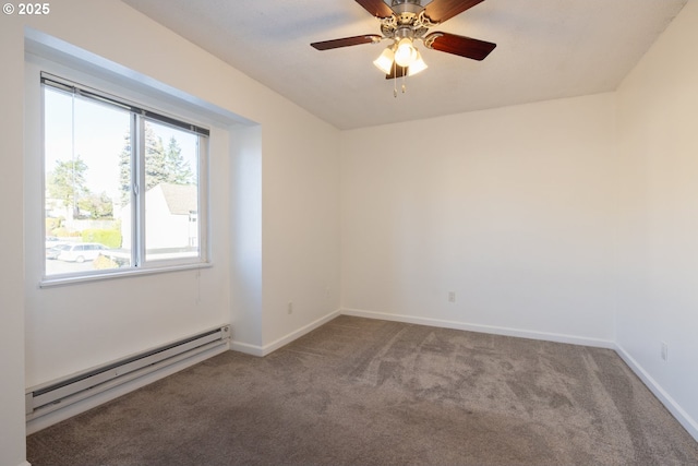 carpeted empty room featuring ceiling fan and a baseboard heating unit