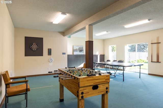 rec room with a textured ceiling and carpet floors