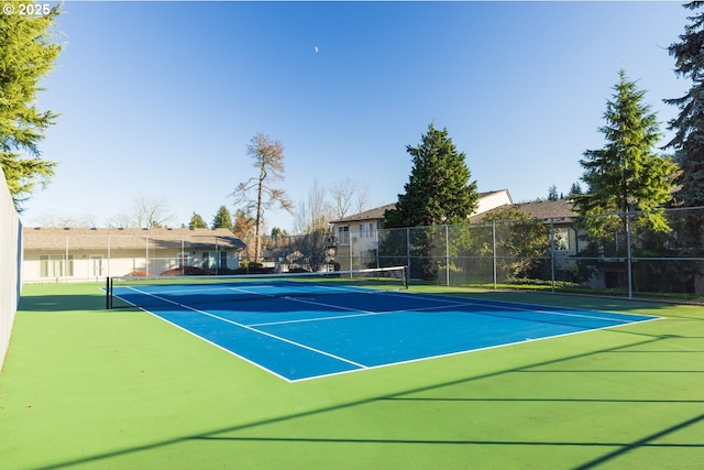 view of sport court with basketball hoop