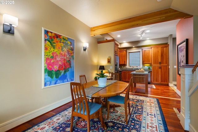 dining area with wood finished floors, baseboards, recessed lighting, and beam ceiling