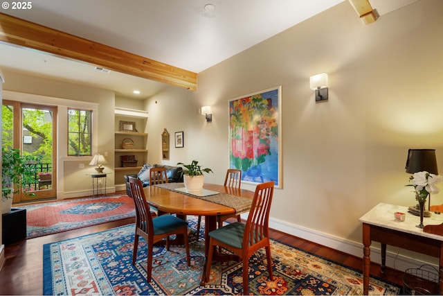 dining room featuring baseboards, beamed ceiling, wood finished floors, and recessed lighting