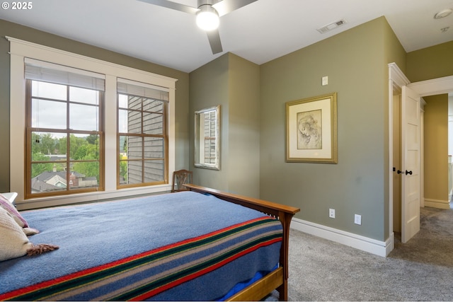 carpeted bedroom with baseboards and a ceiling fan