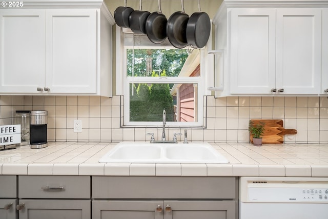 33218 SW Day St, Scappoose, OR 97056 - kitchen with white dishwasher, tasteful backsplash, gray cabinetry, and white cabinetry