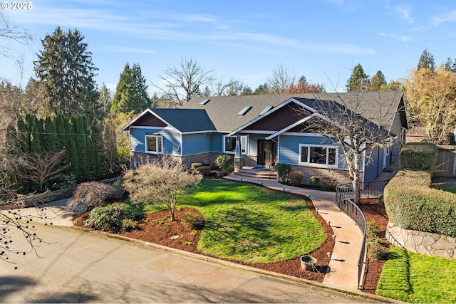 view of front of property featuring stone siding and a front lawn