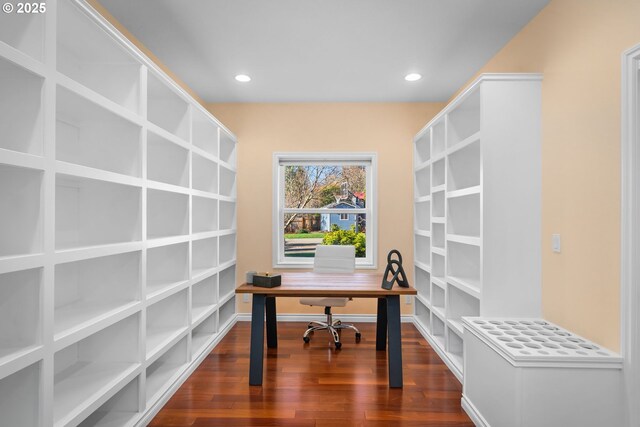 office space with dark wood-type flooring