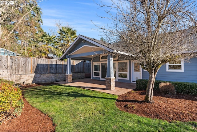 exterior space with a front yard and a patio area