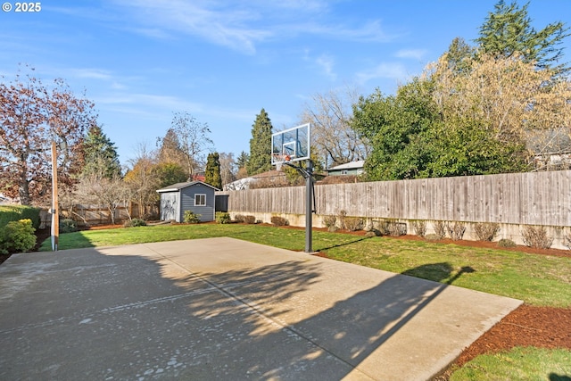 view of patio with basketball court and a shed