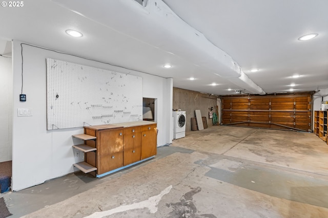 interior space with washer / clothes dryer and a workshop area