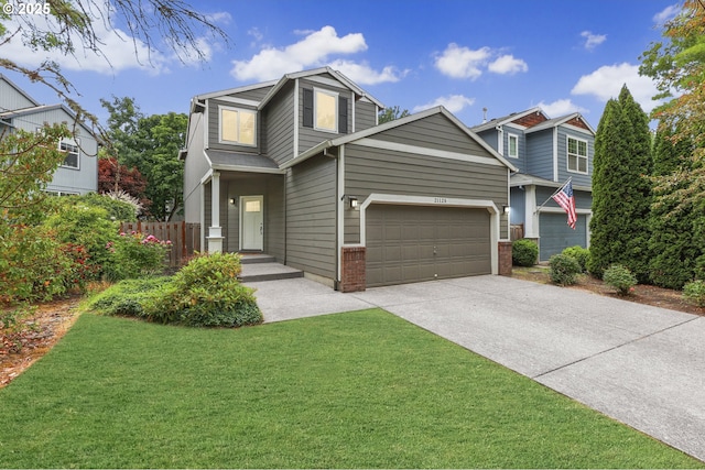 21125 SW Ladyfern Dr, Sherwood, OR 97140 - view of front facade with concrete driveway, an attached garage, and brick siding