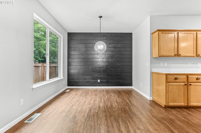 21125 SW Ladyfern Dr, Sherwood, OR 97140 - unfurnished dining area with wood finished floors, a chandelier, and baseboards