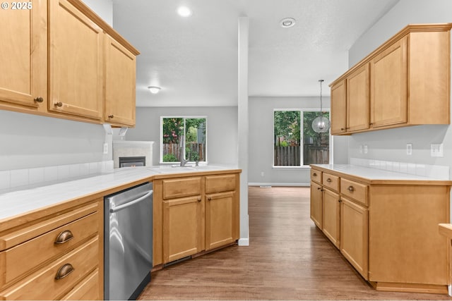 21125 SW Ladyfern Dr, Sherwood, OR 97140 - kitchen featuring dishwasher, tile countertops, light wood-style flooring, healthy amount of natural light, and recessed lighting