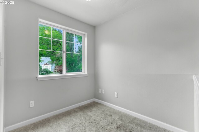 21125 SW Ladyfern Dr, Sherwood, OR 97140 - carpeted empty room with baseboards