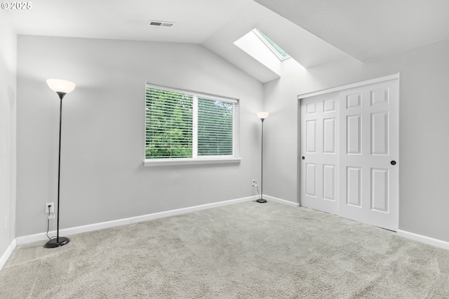 21125 SW Ladyfern Dr, Sherwood, OR 97140 - unfurnished bedroom featuring a skylight, carpet flooring, lofted ceiling, and baseboards