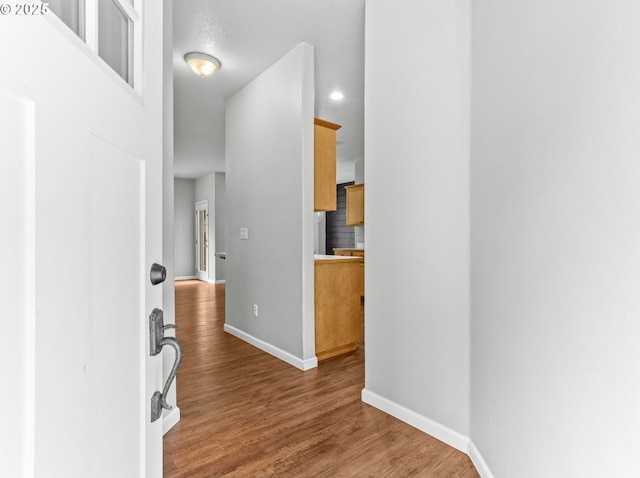 21125 SW Ladyfern Dr, Sherwood, OR 97140 - entrance foyer featuring baseboards, wood finished floors, and recessed lighting