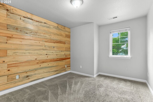 21125 SW Ladyfern Dr, Sherwood, OR 97140 - empty room with wooden walls, baseboards, and carpet