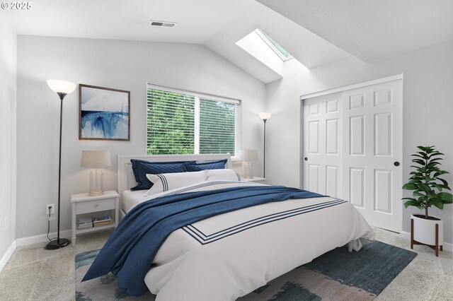 21125 SW Ladyfern Dr, Sherwood, OR 97140 - bedroom with a skylight, baseboards, a closet, lofted ceiling, and speckled floor