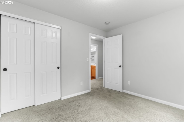 21125 SW Ladyfern Dr, Sherwood, OR 97140 - unfurnished bedroom featuring baseboards, carpet floors, and a closet