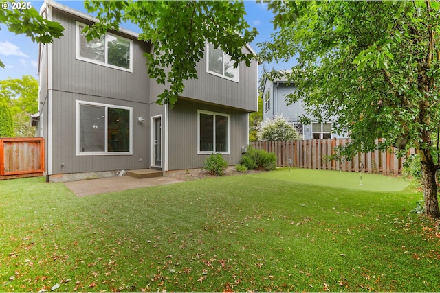 21125 SW Ladyfern Dr, Sherwood, OR 97140 - rear view of property with an area to practice putting
