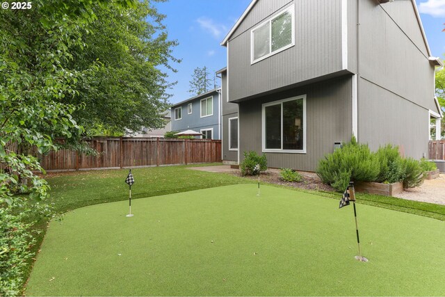 21125 SW Ladyfern Dr, Sherwood, OR 97140 - back of house with a putting green