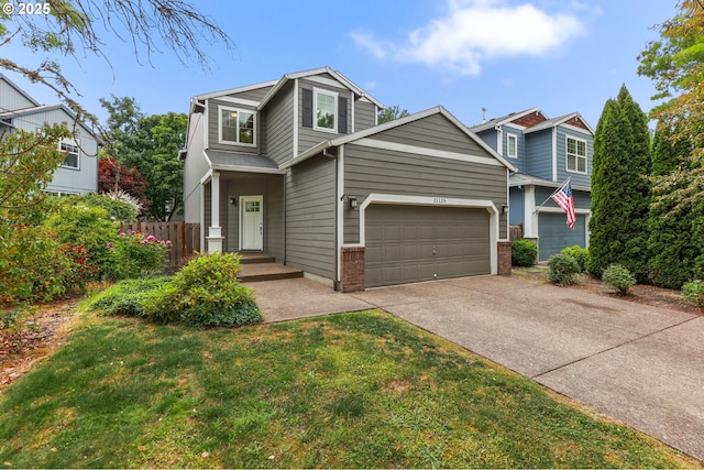21125 SW Ladyfern Dr, Sherwood, OR 97140 - view of front facade featuring driveway and brick siding
