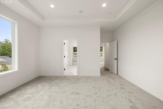 8120 SE 145th Ct, Portland, OR 97236 - unfurnished bedroom featuring multiple windows, a raised ceiling, and recessed lighting