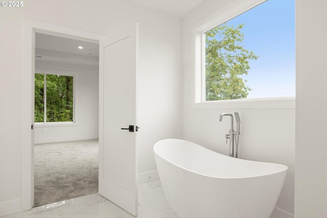 8120 SE 145th Ct, Portland, OR 97236 - full bath featuring a freestanding tub, marble finish floors, baseboards, and recessed lighting
