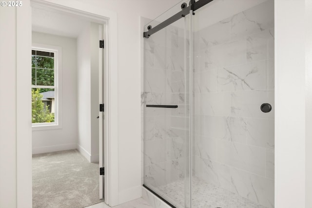 8120 SE 145th Ct, Portland, OR 97236 - bathroom featuring a marble finish shower and baseboards