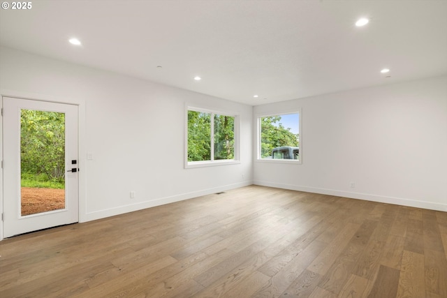 8120 SE 145th Ct, Portland, OR 97236 - spare room with light wood-style floors, recessed lighting, and baseboards