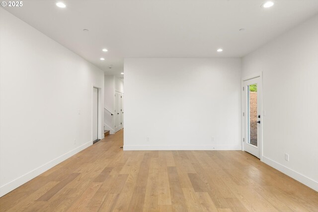 8120 SE 145th Ct, Portland, OR 97236 - spare room with recessed lighting, light wood-style flooring, and baseboards