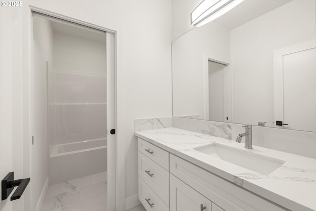 8120 SE 145th Ct, Portland, OR 97236 - full bath featuring marble look tile flooring, vanity, and baseboards