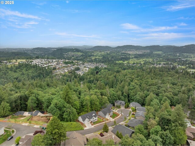 8120 SE 145th Ct, Portland, OR 97236 - aerial view of property's location featuring a forest, mountains, and nearby suburban area