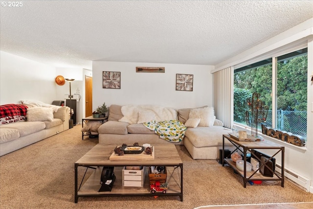 carpeted living room with baseboard heating and a textured ceiling