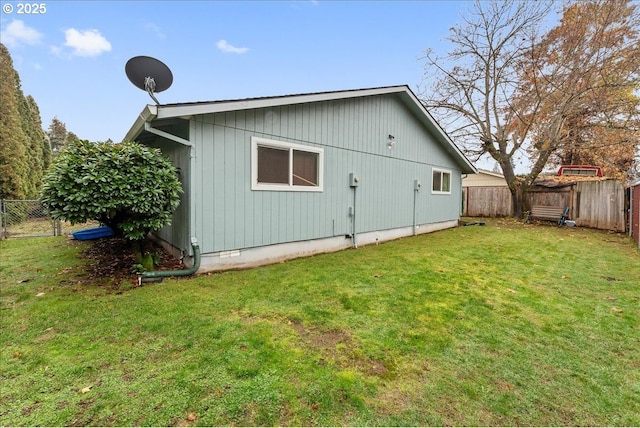 rear view of house with a yard