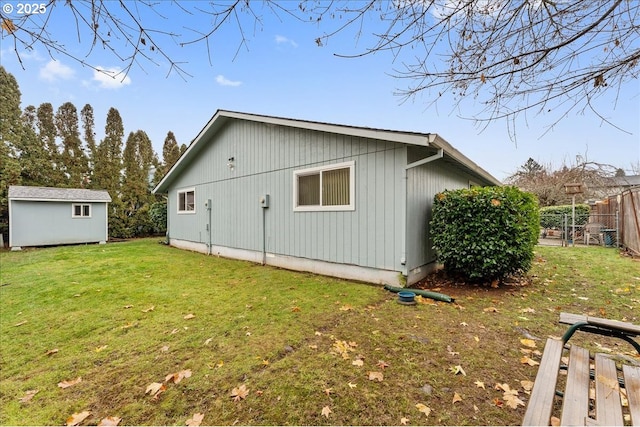 view of property exterior with a storage unit and a yard