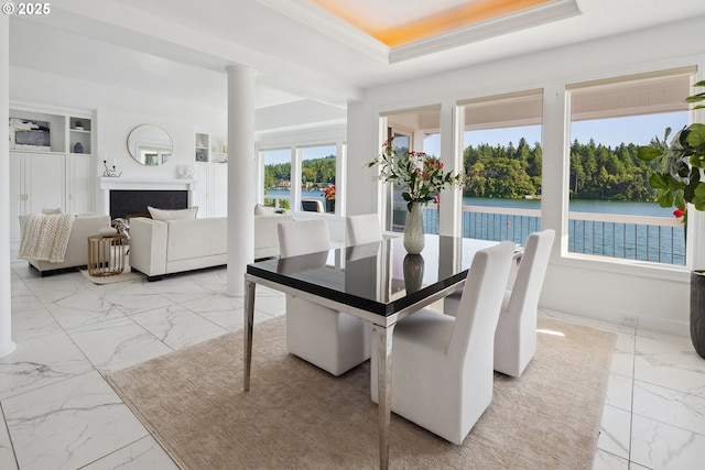 1308 Northshore Rd, Lake Oswego, OR 97034 - dining room featuring light marble finish flooring, a water view, a fireplace, and a raised ceiling
