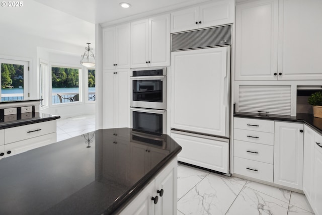 1308 Northshore Rd, Lake Oswego, OR 97034 - kitchen featuring paneled fridge, stainless steel double oven, dark countertops, light marble finish floors, and recessed lighting