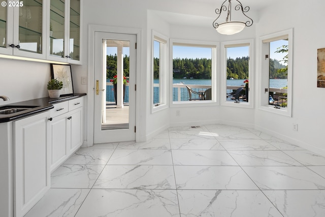 1308 Northshore Rd, Lake Oswego, OR 97034 - unfurnished dining area with baseboards and light marble finish flooring