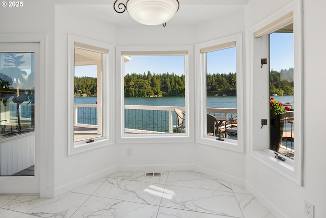 1308 Northshore Rd, Lake Oswego, OR 97034 - unfurnished sunroom with marble look tile flooring, a water view, and healthy amount of natural light