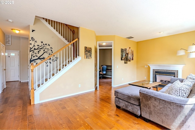 308 SW 38th Loop, Gresham, OR 97080 - living area featuring stairs, light wood-type flooring, and a premium fireplace